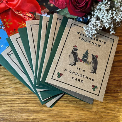 Christmas Critters kraft cards fanned out with envelopes